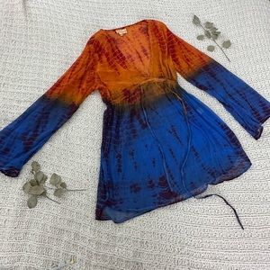 Orange, red, blue, and purple sheer cover up dress.